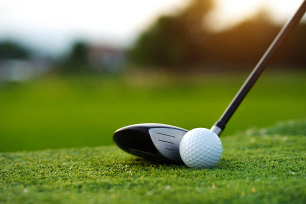 istock Golf balls on the golf course with golf clubs ready for golf in the first short. 1462918249