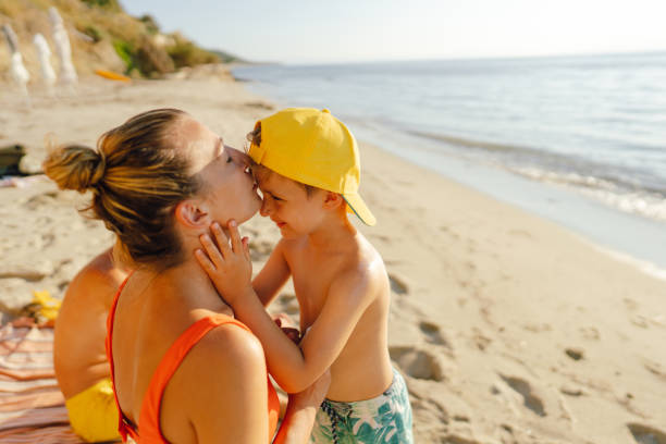 Photo of a happy, smiling family enjoy summer day at the beach