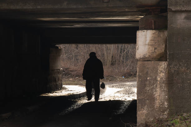istock silhouette of a man passing under a railway bridge in Ukraine 1462931378