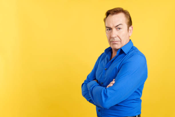 istock Serious mature man turning to face the camera 1462931819