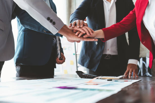 istock Close up Asian Business people stack of hands working together. Teamwork, Unity, business team concept 1462934760