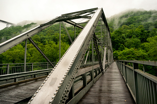 The reconstructed Fayette Station Bridge (Tunney Hunsaker Bridge) located at the bottom of the gorge that crosses the New River, West Virginia. This 40 minute drive was the only way to cross the river until the New River Gorge Bridge was built in 1977.