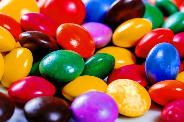 istock Chocolate small candies in multi-colored glaze 1462938374