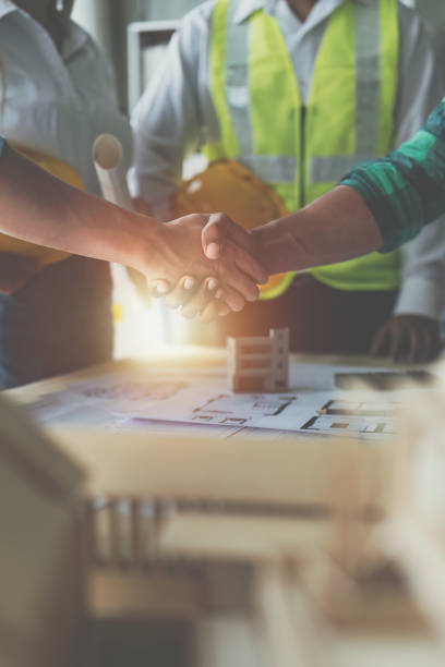 istock Architect people working with blueprints. Civil engineer teams meeting working together. Foreman industry project manager engineer teamwork 1462939338