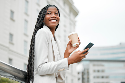 Business, smartphone or black woman in city, coffee or walking on break, typing or social media. Young female, ceo or entrepreneur with tea, phone or connection in street, chatting or search internet