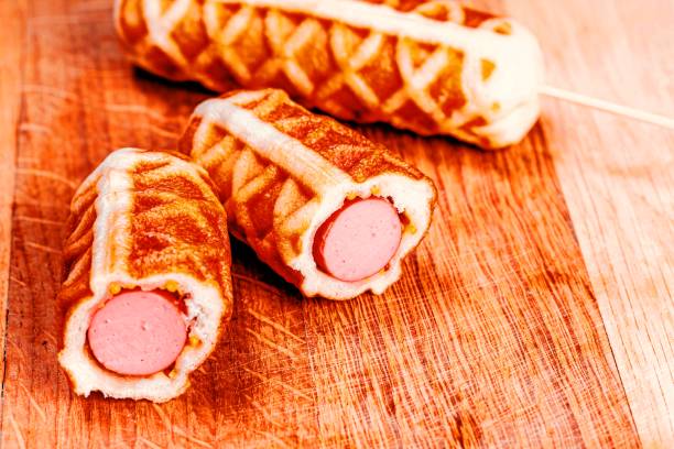 istock Waffle sausages on a wooden kitchen board 1462946289