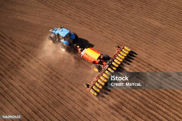 Tractor With Seeder On Field Drone View Stock Photo - Download Image Now - Scenics - Nature, Top - Garment, Crop - Plant