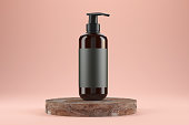 Amber bottle for cream soap on stone podium