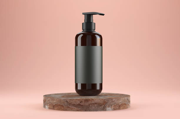 Amber bottle for cream soap on stone podium stock photo