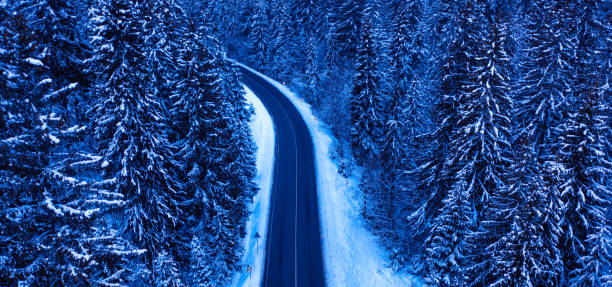 istock Winter road in the mountains drone view 1462962440