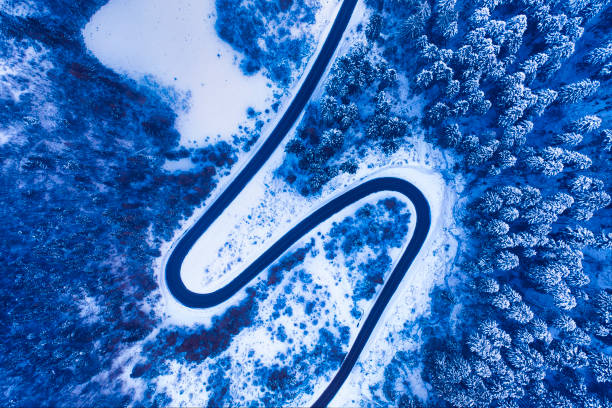 istock Winter road in the mountains drone view 1462962486
