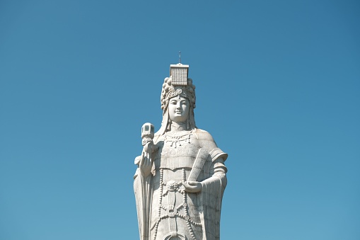 The Statue of Mazu on a blue sky background