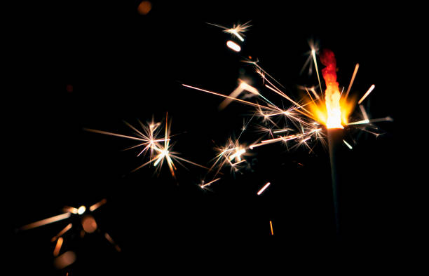 istock Sparks of Bengal fire on a black background 1462964212