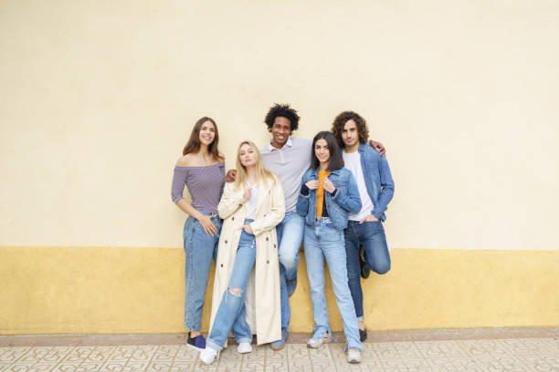 istock Multi-ethnic group of friends posing while having fun and laughing together 1462964277