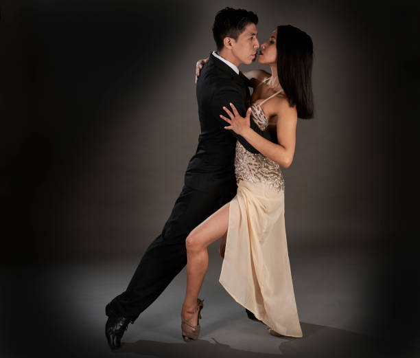 istock Latin female and an Asian male dancing tango 1462964302