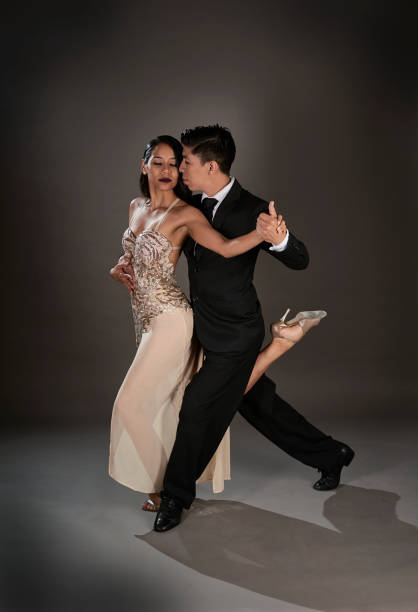 istock Latin female and an Asian male dancing tango 1462964341