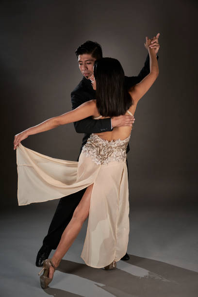 istock Latin female and an Asian male dancing tango 1462964348