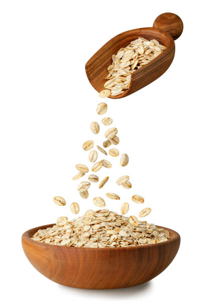istock oatmeal falling from oat ears in bowl isolated on white 1462964658