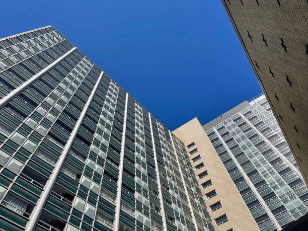 istock Low-angle of sunlit skyscrapers against clear sky 1462966582