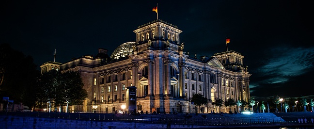 The illuminated German Parliament building Reichstag at late night