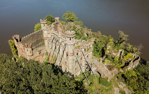 A high-angle of Bannerman castle on a sunny day with water background