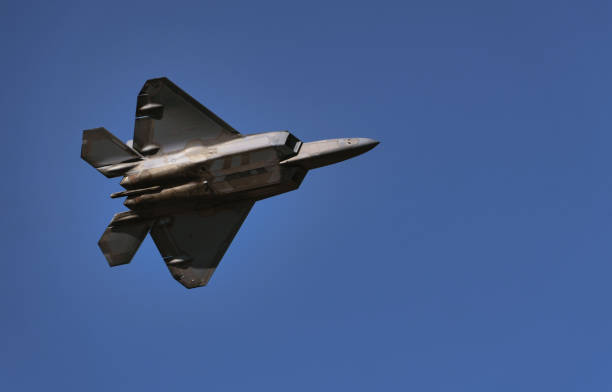 istock Military jet in the blue sky during the daytime 1462975084