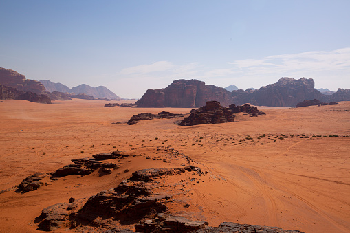Wadi Rum desert in Jordan. Red Mars landscape, red sand and rocky mountains. Wild nature.