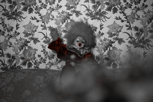 A waving scary clown doll