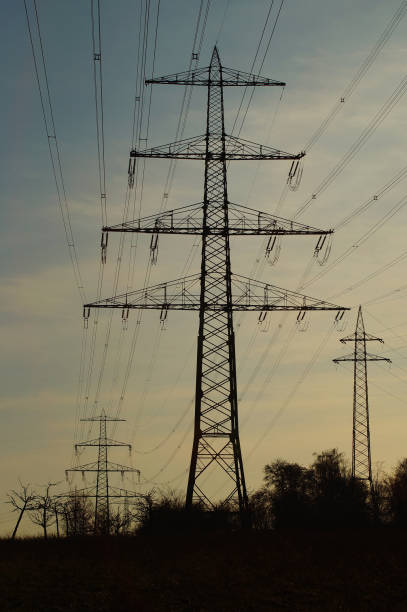 istock High-voltage pylons against the wintry evening sky near Frankfurt. 1462980240