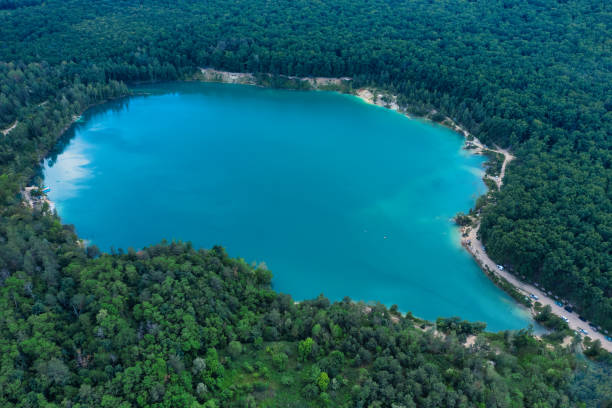 istock Clean lake with blue water in the forest 1462980683