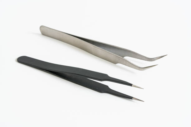 istock Tweezers on a white background 1462982290