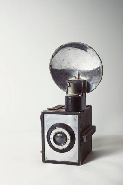 istock Vertical shot of a vintage old camera on a white background 1462987481