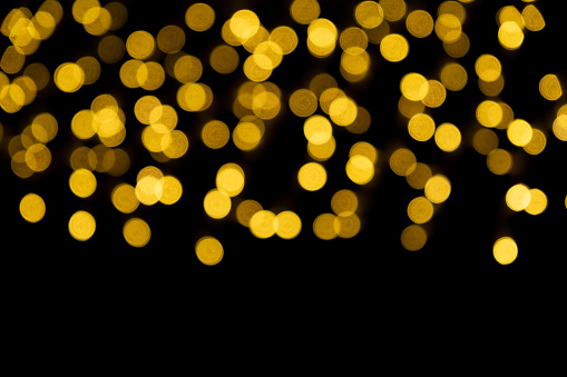 A view of abstract bokeh lights glowing in the darkness