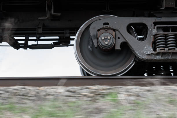 istock Wheels and bogie of freight train moving fast along railroad. 1462989294