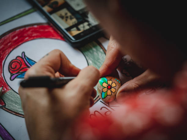 istock Person coloring an object using special tool and vibrant paint colors 1462994000