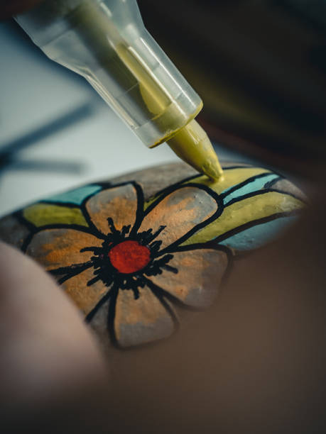 istock Person coloring an object using special tool and vibrant paint colors 1462994001