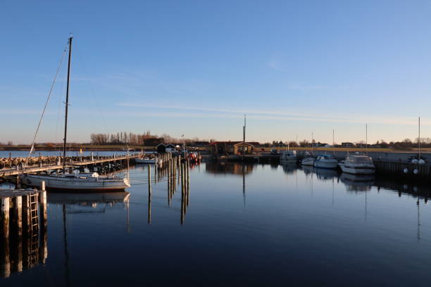 istock Small harbor with calm water and blue sky 1462996074