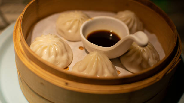 istock Portion of delicious Xiaolongbao with soy sauce 1462997011