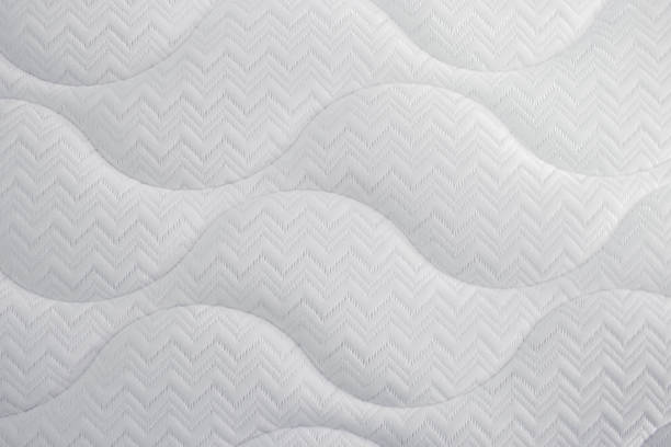 istock Closeup of a white and soft pillow with nice patterns 1463005548