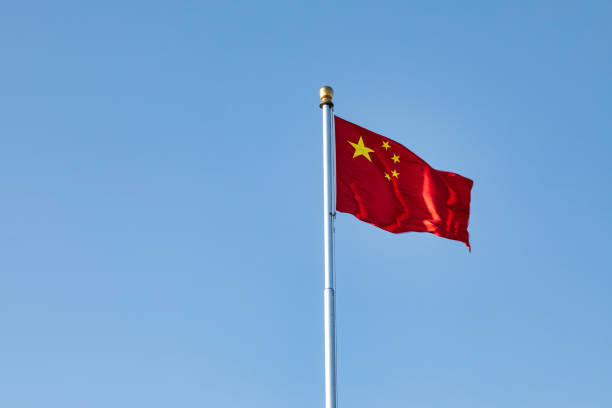 chinese flag Five-star red flag fluttering in the wind under the blue sky chinese flag stock pictures, royalty-free photos & images