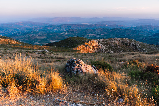 Mountain with vegetation and rocky ground at sunset in Subbetic Mountains in Cordoba, Spain. Concept of landscape.