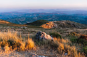 Mountain with vegetation and rocky ground at sunset in Subbetic Mountains in Cordoba, Spain