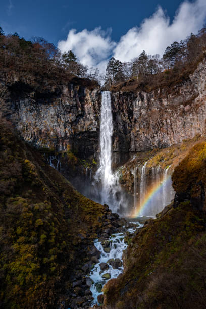 istock Vertical shot of beautiful waterfall falling from mountain 1463006379