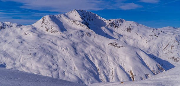 istock Panoramic shot of a snow-covered mountain range in Italy 1463007383