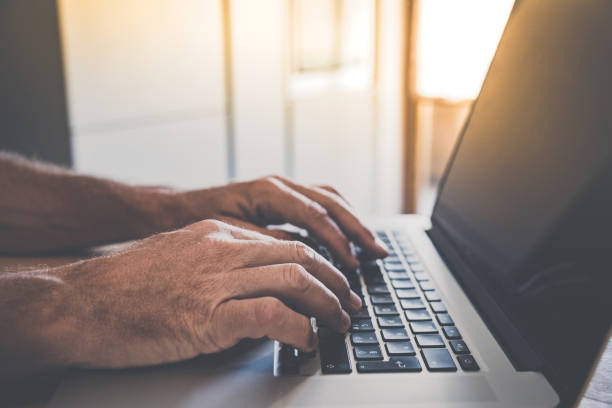 istock Man writing with laptop. Closeup of hands typing on keyboard. Technology, business, work, concept. 1463013341