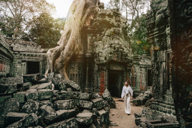istock Traveler Exploring Ancient Ruins of Ta Prohm Temple at Angkor 1463022854