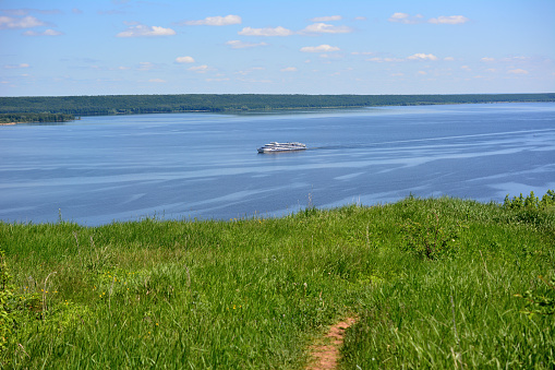 passanger motor ship on the Volga river in sunny day, view from top of the hill