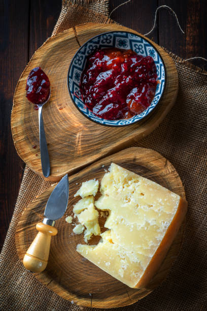 istock Hard cheese with bowl of berry jam 1463029248