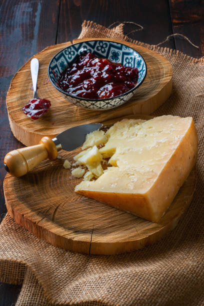 istock Hard cheese with bowl of berry jam 1463029306