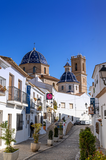 Altea, Spain - 3 February, 2023: historic town center of Altea with the Our Lady of Solace church and whitewashed buildings